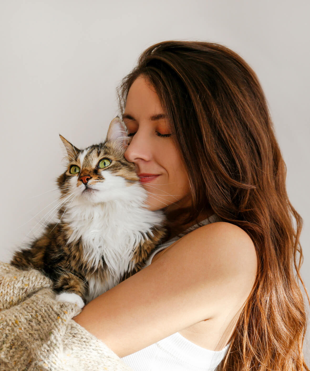 Woman Holding Cat Close